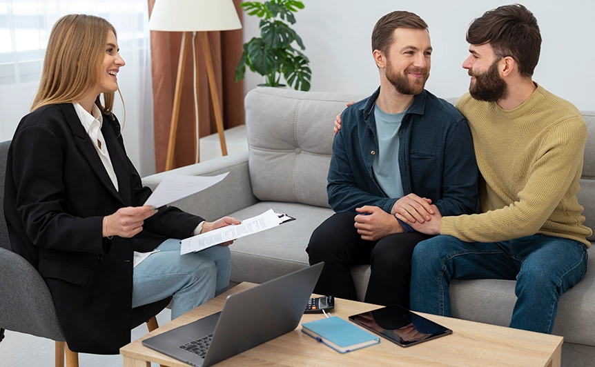 Couple Sitting on Sofa During Relationship Counseling Session with Therapist