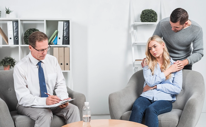Couple in Marriage and Family Counseling Session with Therapist