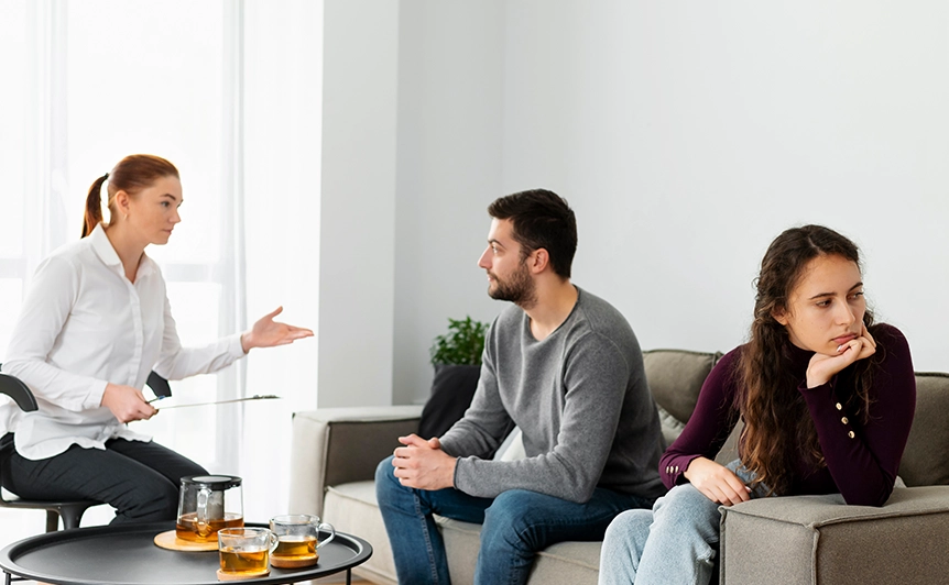 Counselor Mediating Discussion Between Couple in Counseling Upland Office